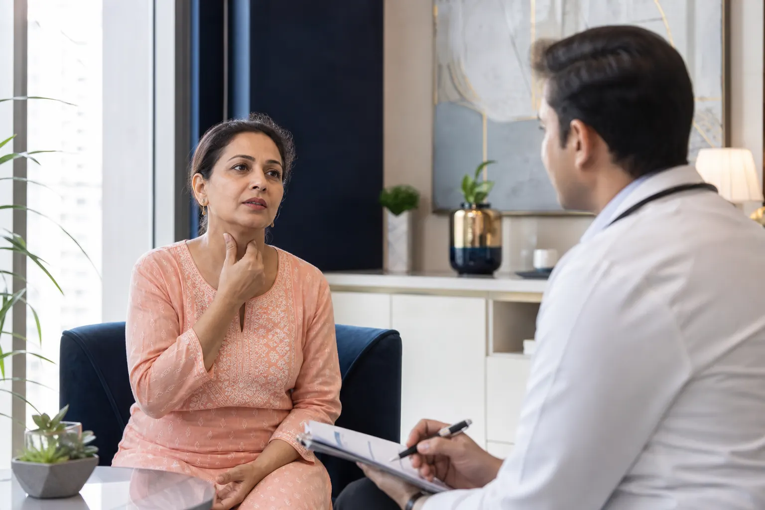 Doctor consulting a patient about underactive thyroid symptoms